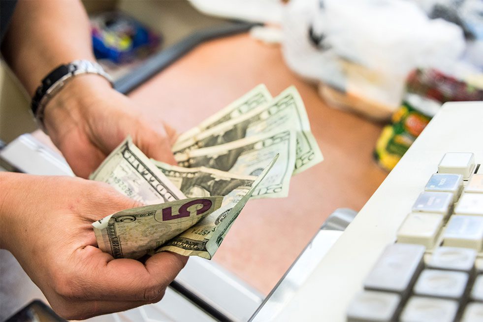 man counting money